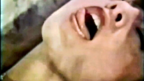 Candice moaning with open mouth in classic porn close-up