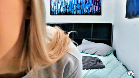 Blonde amateur teen glances at messy bed in bedroom solo
