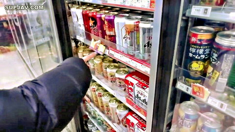 Hand grabbing beer can in Japanese convenience store fridge, JAV scene
