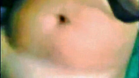 Blurry close-up of amateur Arabic woman's nude belly and hips