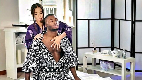 Lia Lin as sexy Asian geisha massages muscular ebony man in robe