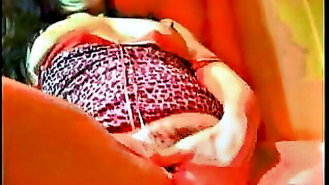 Indian woman in red patterned top during piss fetish scene