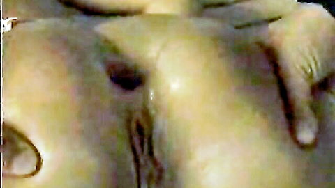 Closeup of big ass cheeks spread wide by hand revealing wet gaping anus and pussy