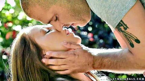 Angel Blade in passionate outdoor kiss with man, autumn warmth vibe