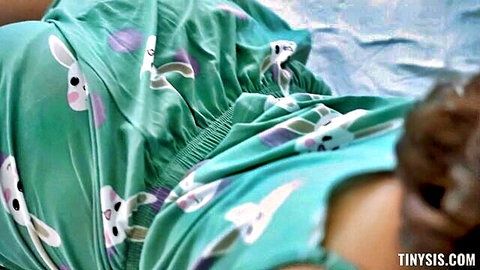 Curvy fair-skinned brunette teen's big ass cheeks exposed bending over in pulled-down green bunny pajamas