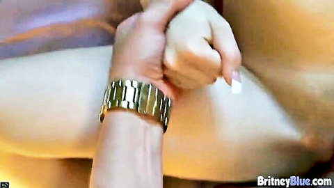 Man's hand with watch grips and fingers petite blonde's shaved pink pussy closeup