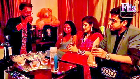 Sexy Indian MILF and cougar in sarees toasting drinks sensually with studs at steamy party