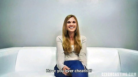 Amateur blonde Kristyna smiling in casting interview, asking if she's ever cheated