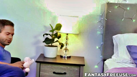 Man in purple shirt holding pink teddy bear on bedroom bed teasing naughty play