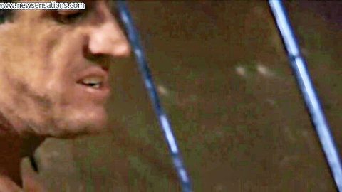 Intense closeup of man's rugged face with open mouth in hardcore porn scene
