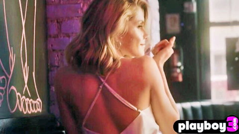 Cute blonde Amelia posing seductively in open-back dress