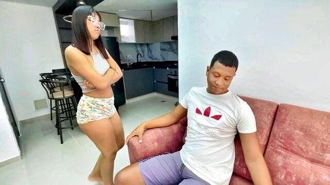 Saraymike as stern Latina step-mom in crop top and shorts confronting seated step-son