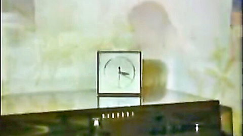 Blurry vintage clock on glass table in retro German housewife porn scene