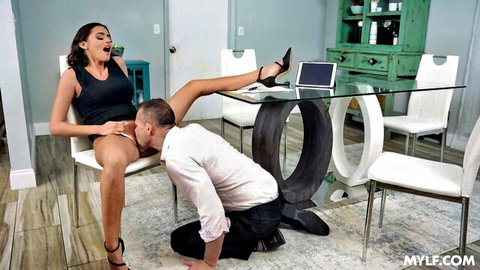 Armani Black milf with 38DD curves receives oral sex from kneeling man in black dress and heels