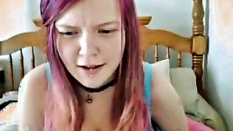 Pink haired emo webcam girl in blue tank top with cleavage