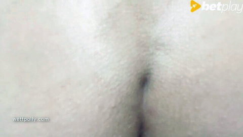 Close-up of wet spread pussy lips exposing pink inner vagina and clit