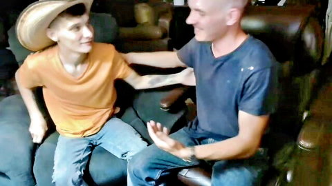 Ethan in hat and orange shirt touched by bald guy, gay amateur gamer tease