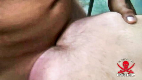 Muscular dark-skinned man gripping pale neck in rough anal sex scene