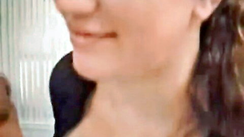 Busty woman smiling during intense titfuck session