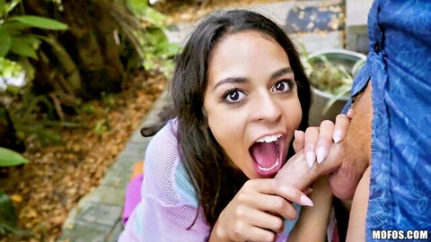 Young skinny ebony teen with small tits sucking thick cock outdoors in garden