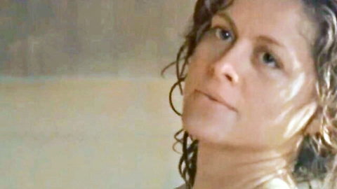 Nadia Capone seductive side profile with wet curly hair in The Outer Limits scene
