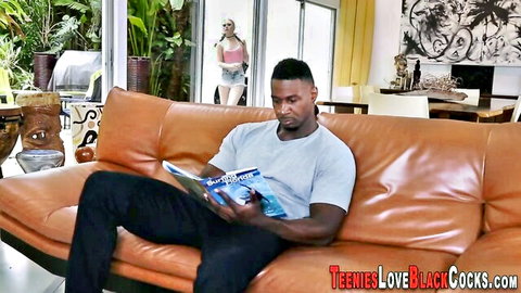 Cute blonde teases muscular black stud reading on couch, BBC suck preview