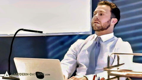 Seth Gamble in suit at office podium, teasing Modern Day Sins scene with Kenna James