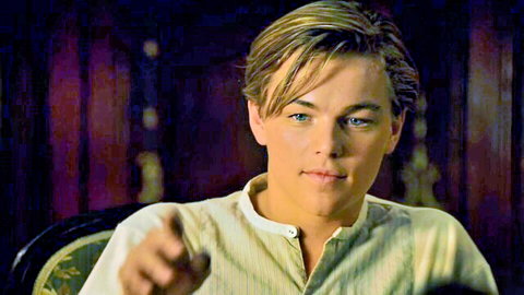 Kate Winslet in Titanic 1997, young man pointing in formal scene