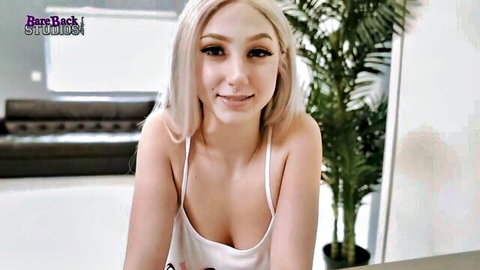 Blonde teen with huge tits in tight white tank top teasing deep cleavage
