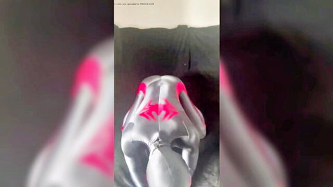 Black Spidey in shiny silver and pink bodysuit, arched back pose showing off body