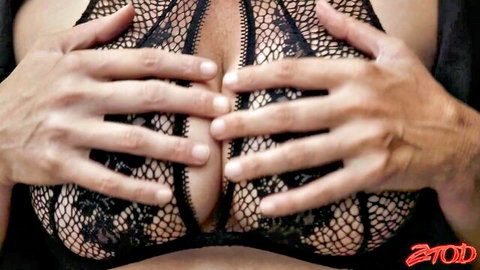 Busty mature wife in black lace bra, hands squeezing her large breasts sensually