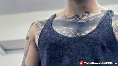 Tattooed Japanese hunk in tank top revealing intricate chest and neck tattoos