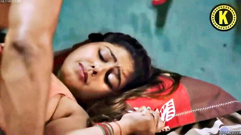 Man gropes big tits of sexy Indian housewife in orange saree on bed