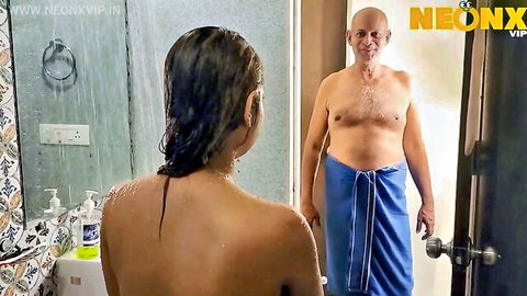 Naked wet Indian housewife showers while bald old man stares at her ass from doorway