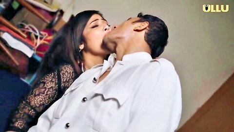 Passionate kiss between Indian cougar in black lace and young man