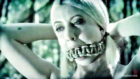Stunning blonde bound and gagged with rope in kinky forest adventure