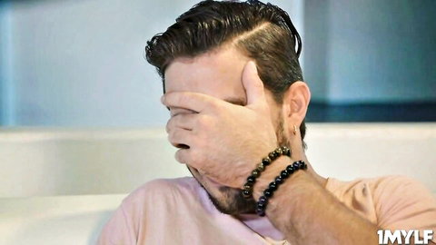 Stepson covering eyes shyly as Christy Love makes him comfy