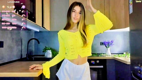 Skinny blonde webcam girl teasing in sheer yellow crochet top and white shorts