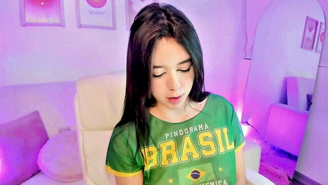Steff London camgirl in sexy Brazil shirt, teasing with big boobs
