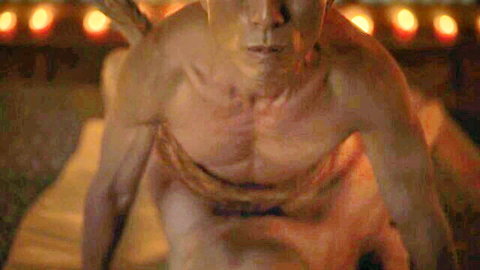 Muscular Asian man in intense Lovecraft Country scene with Jamie Chung