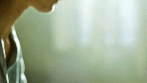 Close-up of intense side profile in collared shirt, Brutalist handjob scene