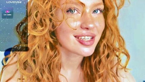 Sanda Red skinny redhead cam girl smiling with freckles and curly hair