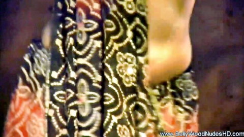 Sexy Indian babe bends over exposing bare juicy ass cheeks in saree striptease