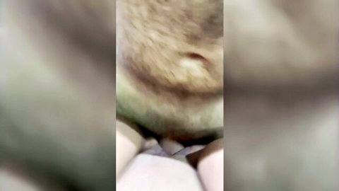 Blurry close-up of hairy wet pussy spread wide by fingers showing pink labia