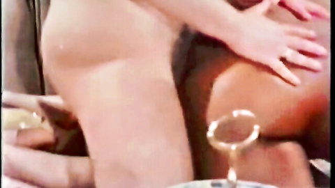 Vintage interracial cowgirl sex with white woman riding black man, nude orgasm scene