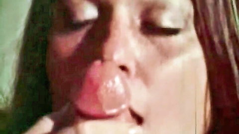 Asian woman seductively sucking lollipop close-up in classic hardcore XXX
