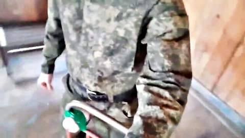 Russian soldier in camo uniform masturbating with green fleshlight toy