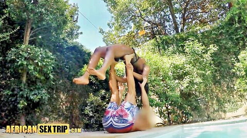 Ebony big tits babe in topless yoga lift by pool with friend