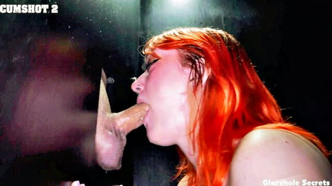 Redhead sucking cock through gloryhole in Gloryhole Secrets cumshot scene
