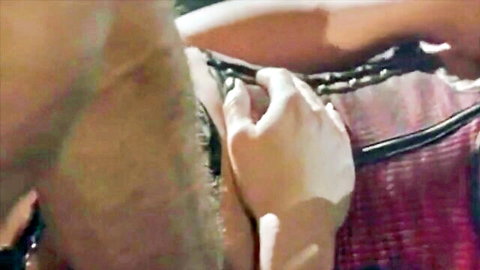Man's hand roughly squeezing woman's big tits in black strappy lingerie